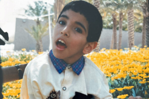 Boy and yellow flowers Kuwait