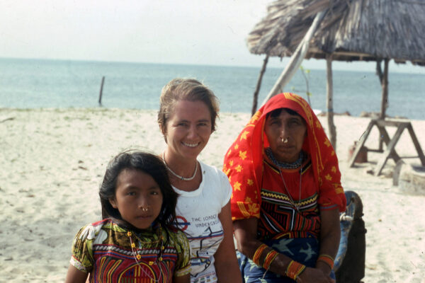 Anne Watts on beach with Guna people