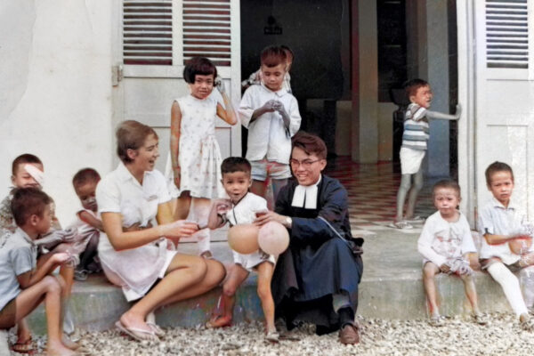 Anne Watts nurse with sick children in Vietnam