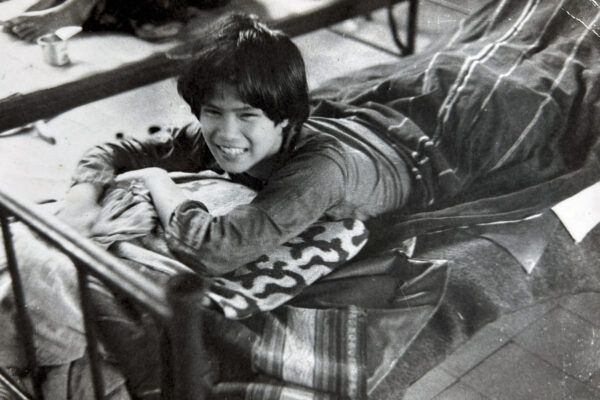 Sick child on a bed in Kon Tum hospital during the Vietnam war