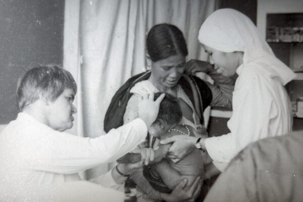 Nurse, mother and sick baby during Vietnam war
