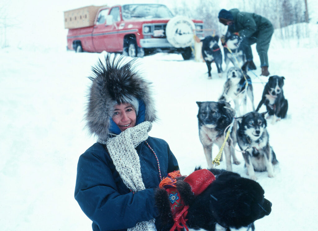 Anne Watts at Eskimo Point Canada with husky dogs