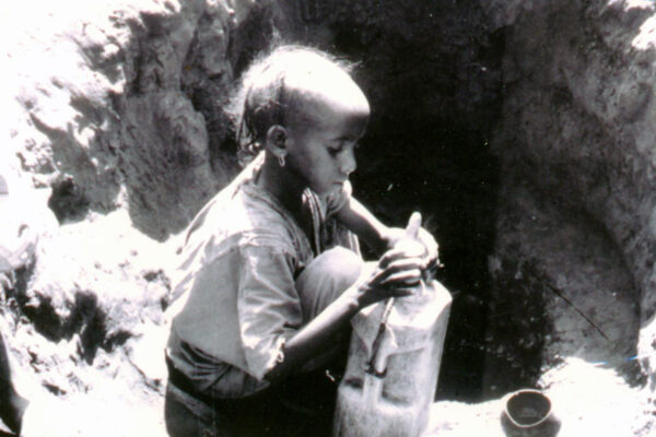 young girl and water container